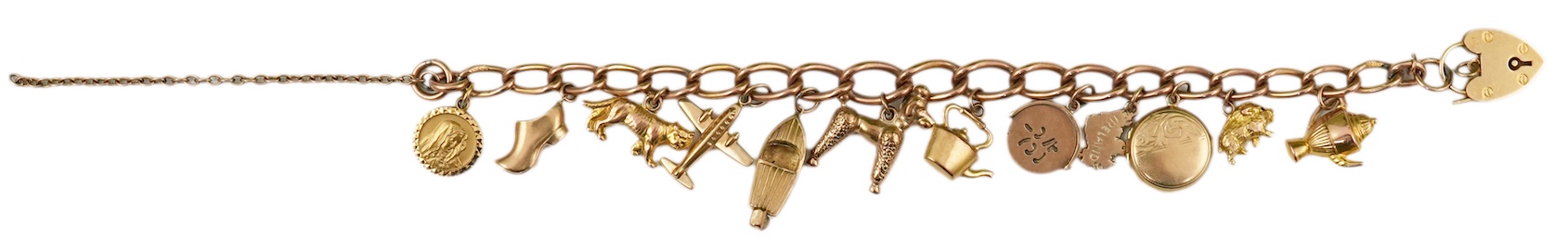 A gold charm bracelet, mid 20th century